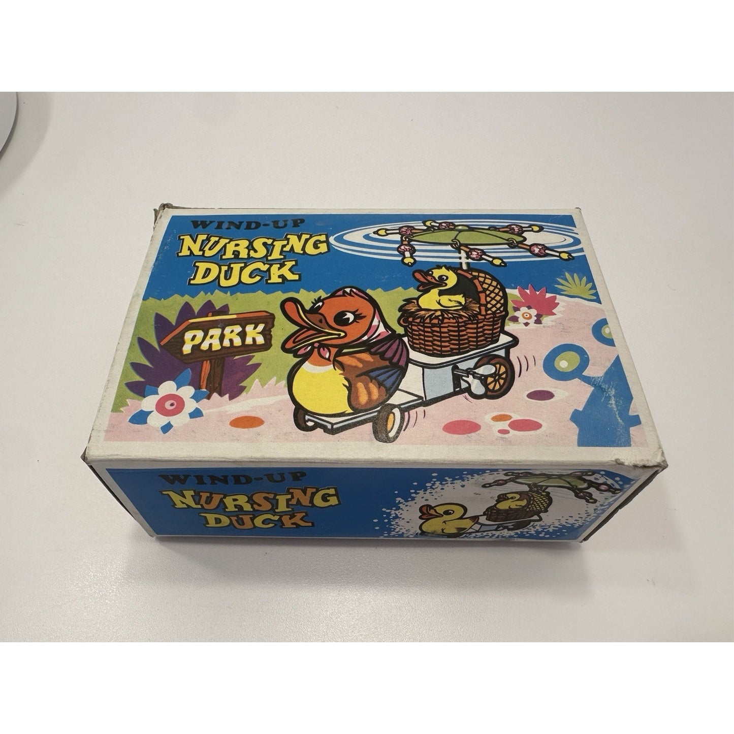 VINTAGE *NEW* 1960's Wind Up Nursing Duck with Baby under Parasol