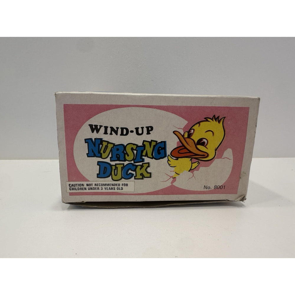 VINTAGE *NEW* 1960's Wind Up Nursing Duck with Baby under Parasol