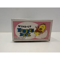 VINTAGE *NEW* 1960's Wind Up Nursing Duck with Baby under Parasol