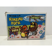 VINTAGE *NEW* 1960's Wind Up Nursing Duck with Baby under Parasol